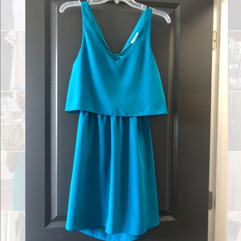 Teal mini dress with bow cut out back